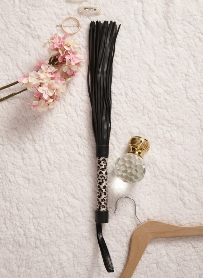 Whip with animal print handle