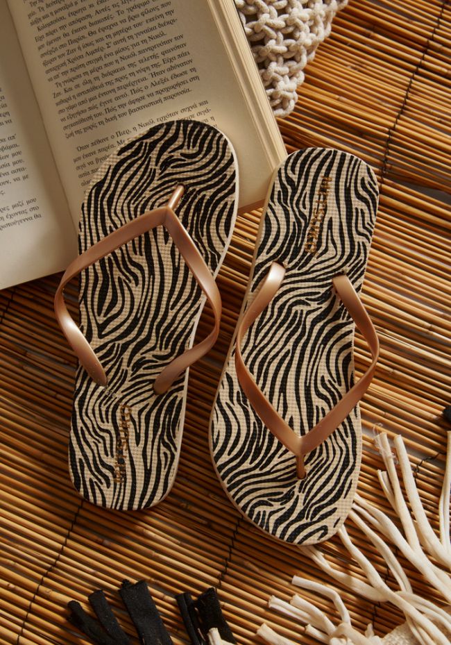 Women's zebra print flip flops